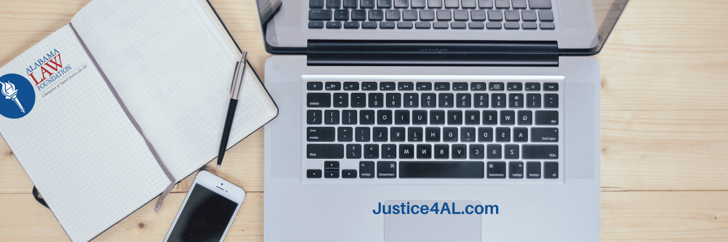 Laptop computer accessing Justice4AL website