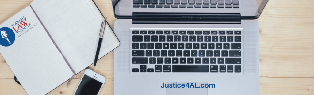 Laptop computer accessing Justice4AL website